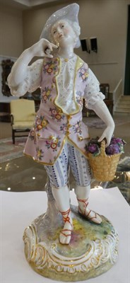 Lot 545 - ~ A Meissen Porcelain Figure of a Girl, circa 1900, in 18th century costume playing cards on a...