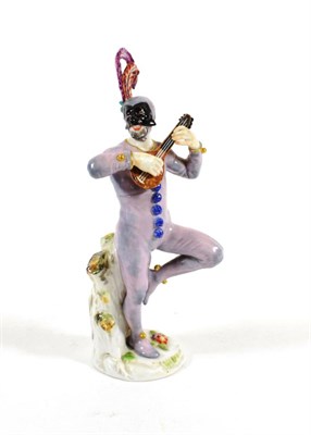 Lot 546 - A Meissen Porcelain Figure of Harlequin, 20th century, wearing a feathered cap and mask,...