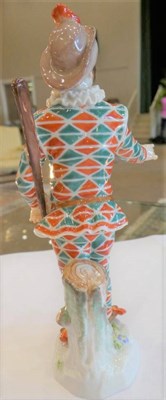 Lot 547 - A Meissen Porcelain Figure of Harlequin, 20th century, standing wearing a feathered cap, mask...