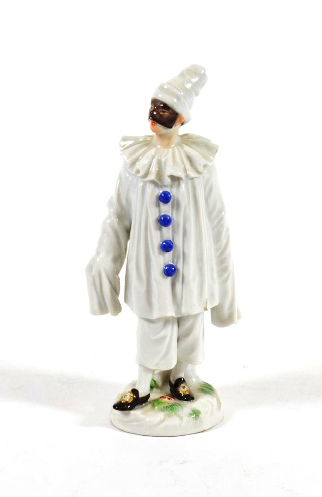 Lot 548 - A Meissen Porcelain Figure of Pierrot, 20th century, standing wearing a mask and white robes...