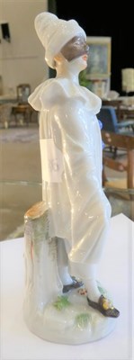 Lot 548 - A Meissen Porcelain Figure of Pierrot, 20th century, standing wearing a mask and white robes...