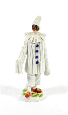 Lot 549 - A Meissen Porcelain Figure of Pierrot, 20th century, standing wearing a mask and white robes...