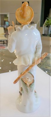 Lot 550 - A Meissen Porcelain Figure of Pulcinella, 20th century, standing wearing a brown hat holding a...