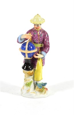 Lot 552 - A Meissen Porcelain Figure of a Chinese Astronomer, 20th century, standing beside a globe holding a