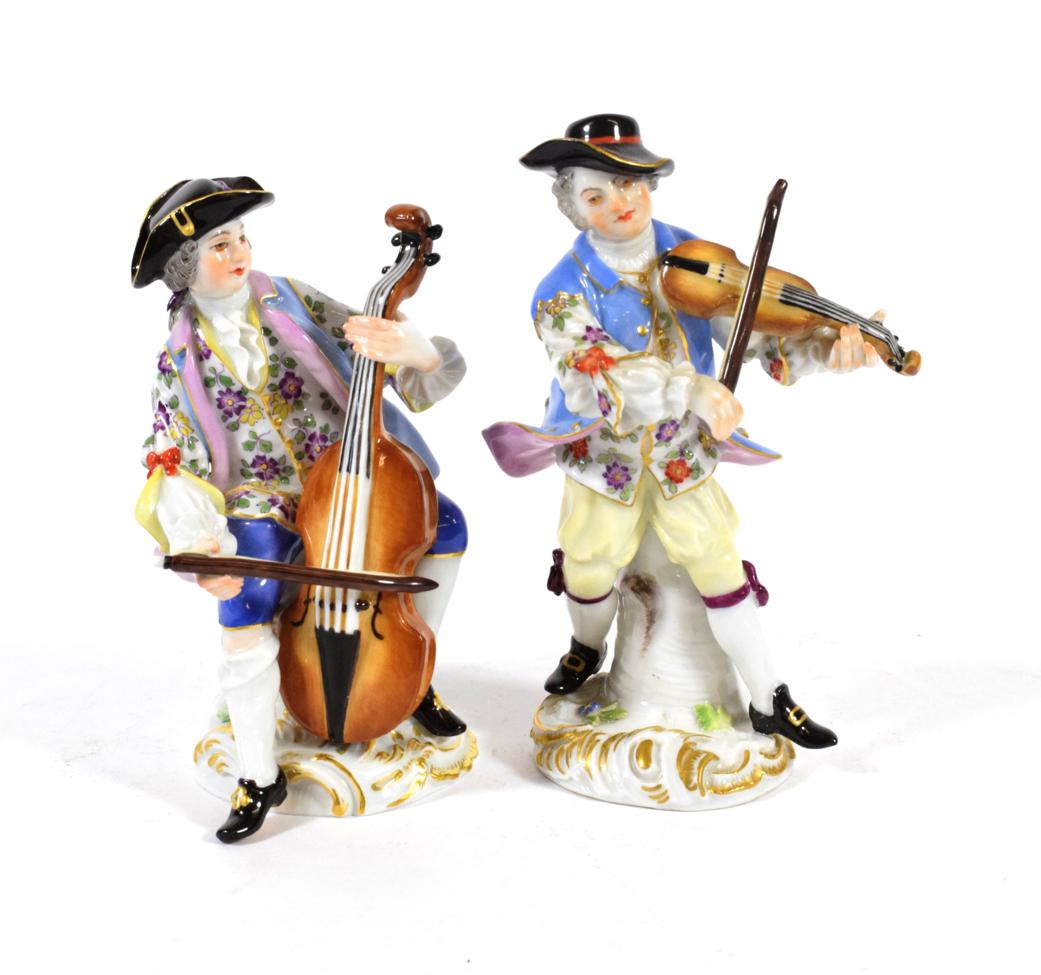 Lot 556 - A Pair of Meissen Porcelain Figures of Musicians, 20th century, one standing playing the...