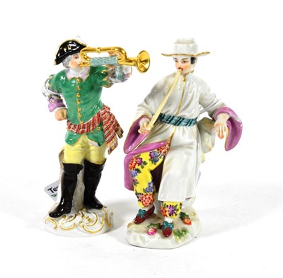 Lot 557 - A Meissen Porcelain Figure of a Huntsman, 20th century, standing wearing a green jacket playing...