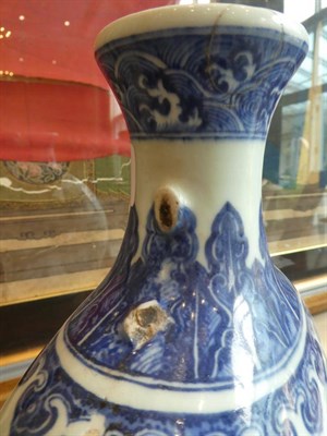 Lot 563 - A Chinese Porcelain Moon Flask, Qing Dynasty, probably Qianlong, painted in underglaze blue...