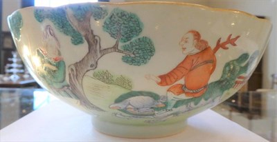 Lot 564 - A Chinese Porcelain Bowl, painted in famille rose enamels with various foreigners in formal...