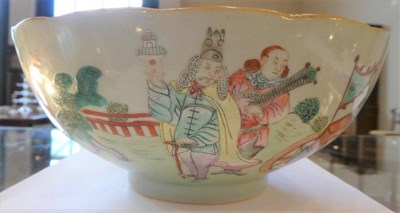 Lot 564 - A Chinese Porcelain Bowl, painted in famille rose enamels with various foreigners in formal...