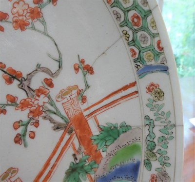 Lot 568 - ~ A Chinese Porcelain Saucer Dish, Kangxi, painted in famille verte enamels with chrysanthemums...