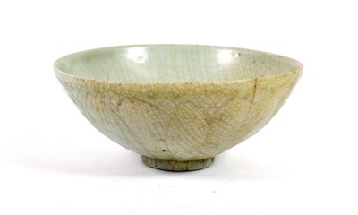 Lot 571 - A Chinese Ge Ware Celadon Lotus Bowl, probably Southern Song Dynasty, of circular form, moulded...