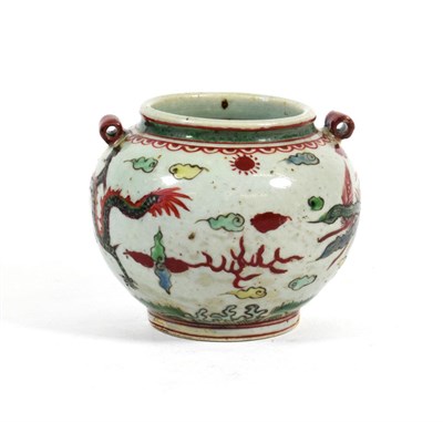 Lot 574 - A Chinese Wucai Globular Jar, early 17th century, with tubular handles, painted with a dragon...