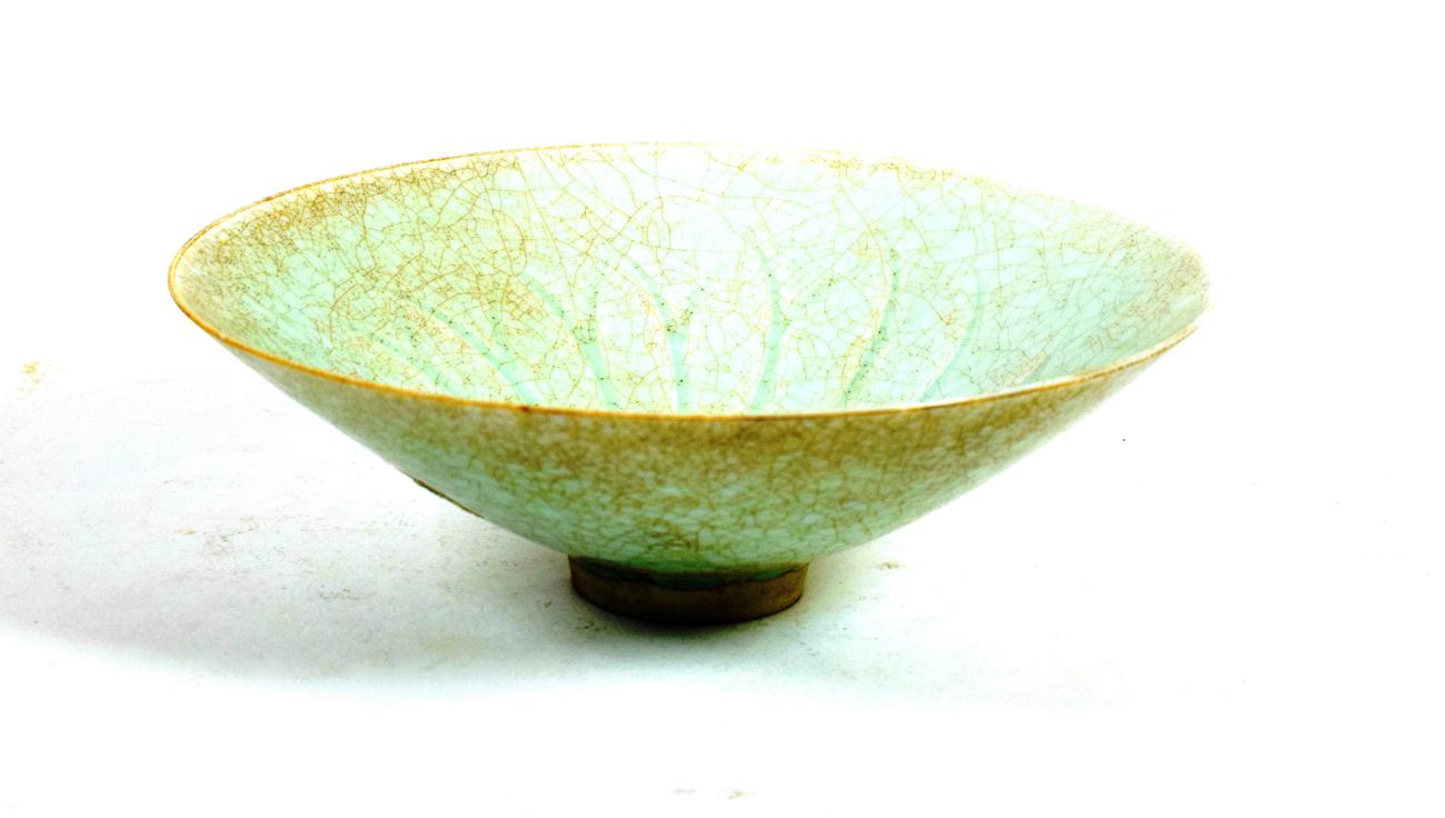 Lot 577 - A Chinese Qingbai Porcelain Bowl, probably Song Dynasty, of conical form, the interior incised with