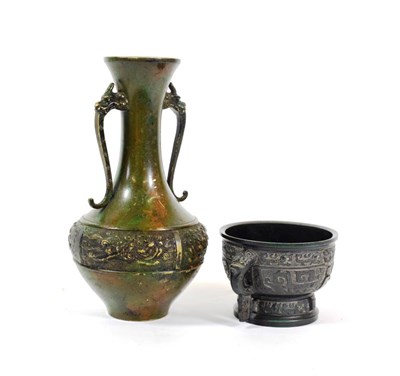 Lot 586 - A Chinese Bronze Gui, of archaic form with loop handles cast with Taotie and scrolls, 15cm...