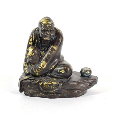 Lot 587 - A Chinese Bronze Figure of Lohan Vijraputra, Qing Dynasty, the seated figure of traditional...