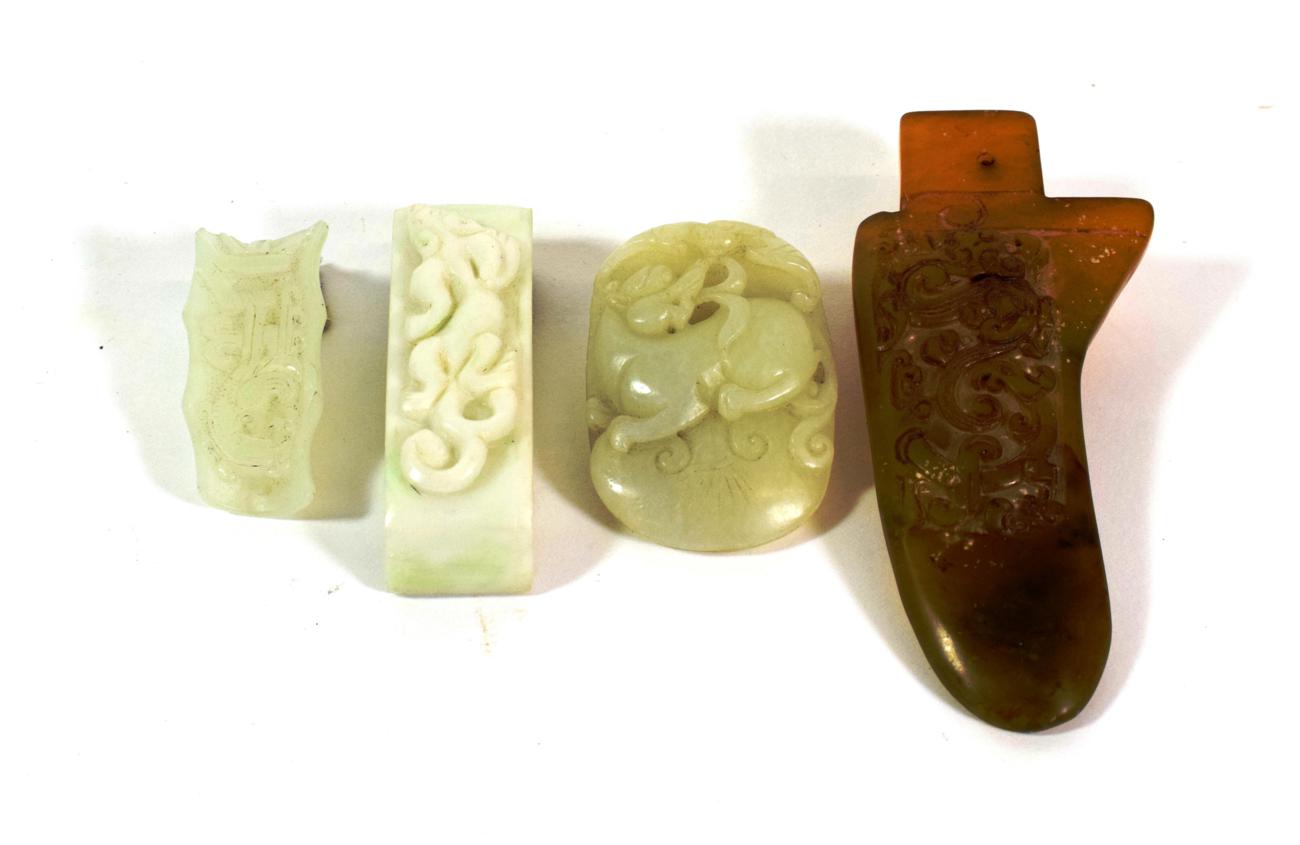 Lot 594 - A Chinese Ochre Jade Axe Head, of archaistic form carved with a mythical beast, 11.5cm long; A Jade