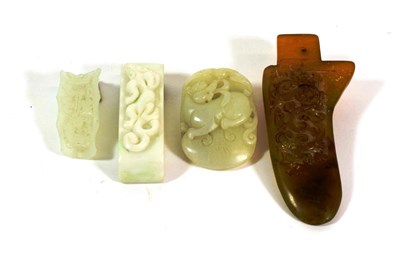 Lot 594 - A Chinese Ochre Jade Axe Head, of archaistic form carved with a mythical beast, 11.5cm long; A Jade