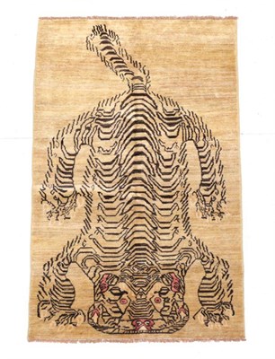 Lot 665 - Tiger Rug Nepal/Tibet, modern The pale mushroom field with semi-naturalistic tiger, 190cm by 120cm