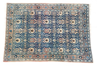 Lot 668 - Veramin Carpet Central Iran, circa 1950 The indigo diamond lattice field of stylised...