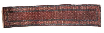 Lot 674 - North West Persian Runner, circa 1910 The madder field of boteh enclosed by borders of angular...