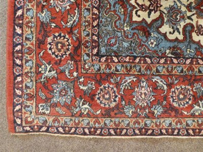 Lot 675 - Isfahan Rug Central Iran, circa 1950 The ivory field of scrolling vines around a flowerhead...