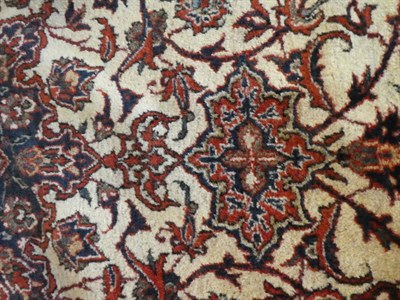 Lot 675 - Isfahan Rug Central Iran, circa 1950 The ivory field of scrolling vines around a flowerhead...