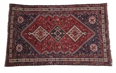 Lot 676 - Kashgai Carpet South West Iran, circa 1930 The madder field of tribal and zoomorphic motifs...