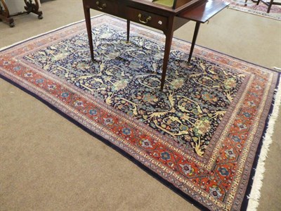 Lot 677 - Tabriz Carpet of Mustafi design Iranian Azerbaijan, circa 1950 The indigo field of plants and...