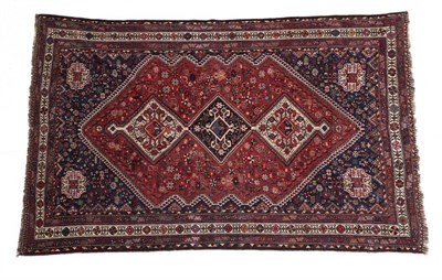 Lot 679 - Anatolian Carpet Possibly Borlu, circa 1900 The ivory field with three medallions framed by...
