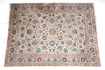 Lot 680 - Kashan Carpet  Central Iran, circa 1950 The cream field of palmettes and large flowering vines...