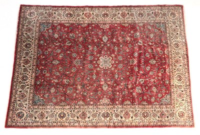 Lot 681 - Saroukh Carpet West Iran, 2nd half 19th century The faded terracotta field of scrolling vines...