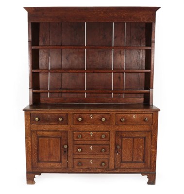 Lot 685 - ~ A George III Oak Dresser and Rack, late 18th century, with three fixed shelves, the base with...