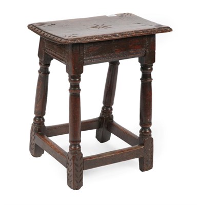 Lot 692 - An Oak Joint Stool, circa 1680, the four peg rectangular top with carved edge above a moulded...