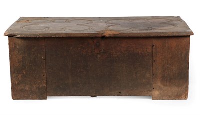 Lot 704 - An English Joined Oak Clamped-Front Chest, 13th-15th century, the hinged lid carved in the form...