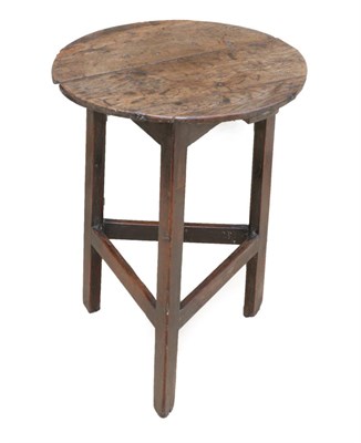 Lot 708 - A George III Circular Oak Cricket Table, late 18th century, on chamfered legs joined by...