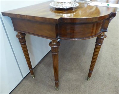 Lot 720 - A George III Mahogany Serpentine Shaped Serving Table, early 19th century, with plain frieze...
