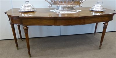Lot 720 - A George III Mahogany Serpentine Shaped Serving Table, early 19th century, with plain frieze...