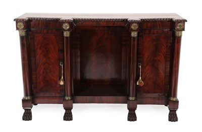 Lot 726 - A Regency Mahogany and Brass Mounted Breakfront Dwarf Bookcase, with carved border and two cupboard