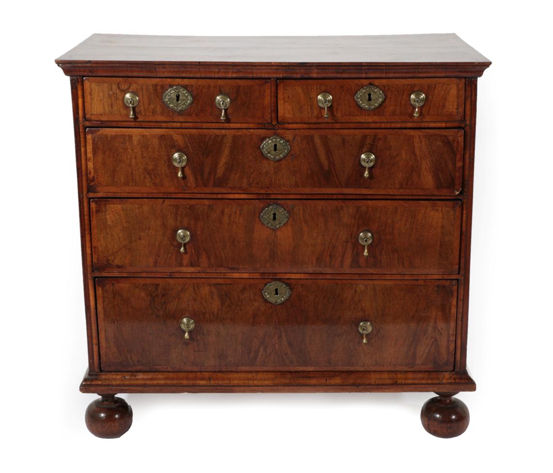 Lot 727 - A George I Walnut and Feather-Banded Straight Front Chest of Drawers, early 18th century, the...