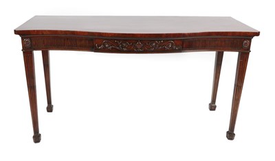 Lot 728 - A George III Mahogany Serpentine Shaped Serving Table, late 18th century, the fluted cornice...