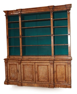 Lot 755 - An Early Victorian Burr Walnut Breakfront Library Bookcase, circa 1860, the upper section with...