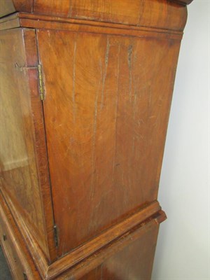 Lot 757 - ~ A George I Figured Walnut and Feather-Banded Cabinet on Stand, early 18th century, with...