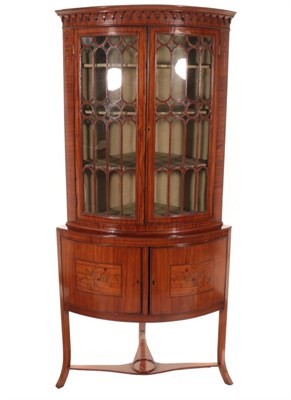 Lot 766 - ~ A Late 19th Century Satinwood and Ebony Strung Bowfront Hanging Corner Cupboard, the arcaded...