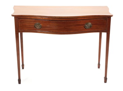 Lot 768 - ~ A George III Mahogany Serpentine Shaped and Crossbanded Writing Table, circa 1800, with a...
