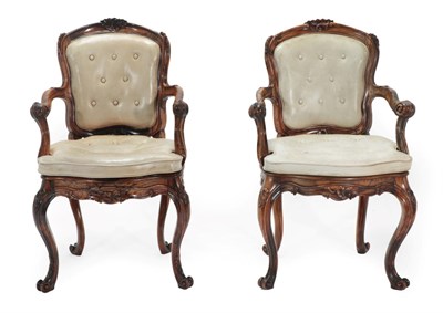 Lot 784 - A Pair of Mid 19th Century Walnut Armchairs, recovered in light beige close-nailed and buttoned...