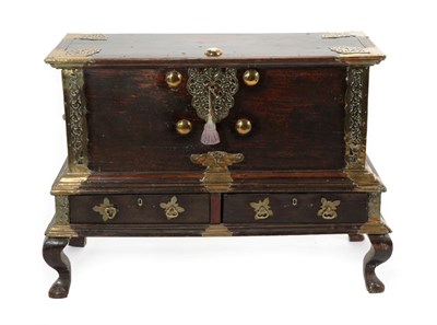 Lot 791 - A 19th Century Hardwood and Brass Bound Zanzibar Chest on Stand, with decorated brass strapwork and