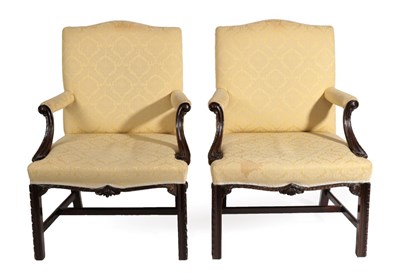 Lot 794 - A Pair of 19th Century Carved Mahogany Library Armchairs, in George III style, recovered in...