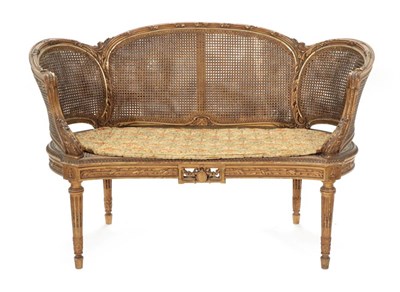 Lot 801 - ~ A Late 19th/Early 20th Century Carved Giltwood Two-Seater Sofa, the double canted back...