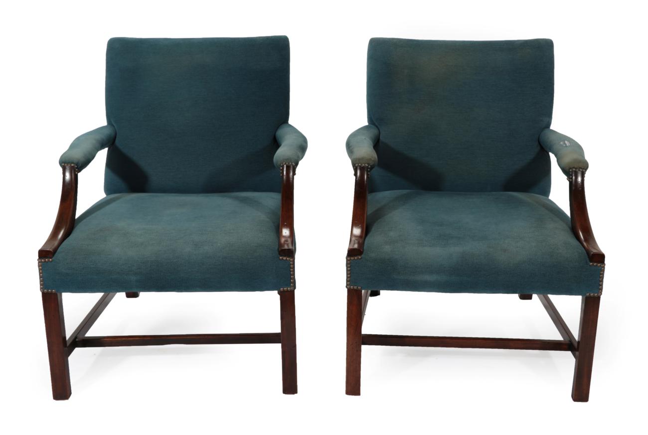 Lot 803 - A Pair of Late 19th Century Gainsborough Style Library Armchairs, covered in blue close-nailed...