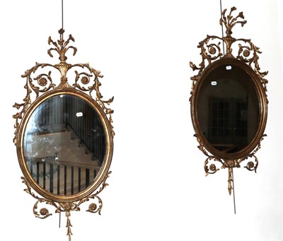 Lot 816 - A Pair of Giltwood and Gesso Oval Mirrors, late 19th/early 20th century, the moulded frames...